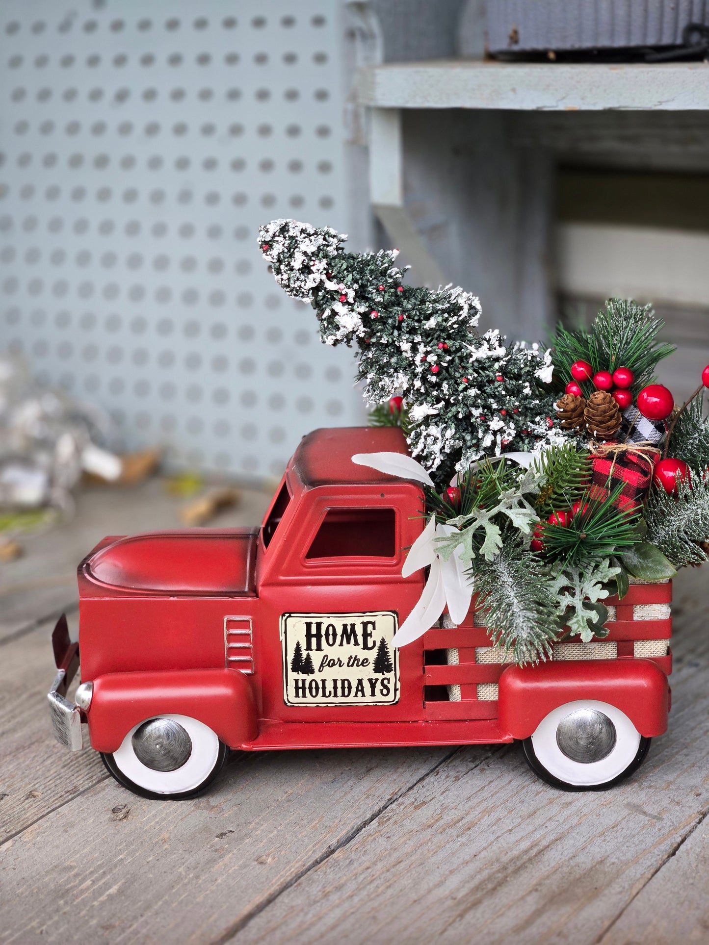Red Metal Truck For the Holidays With Artifical Pine Arrangement